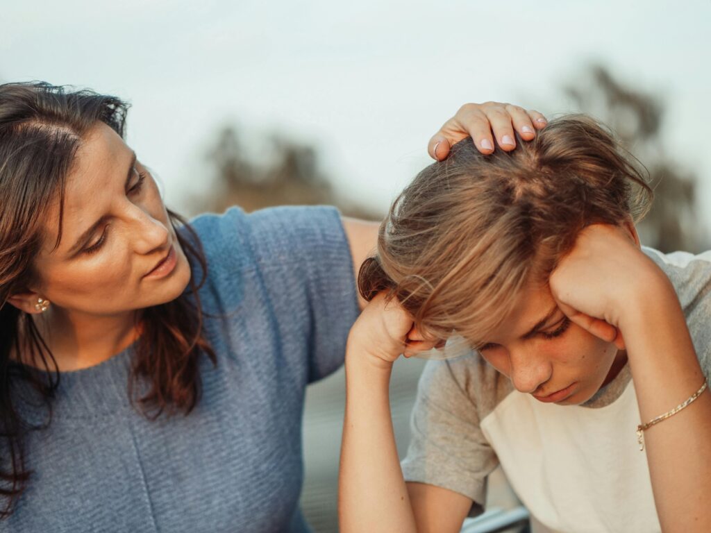 A mother offers support with calm, kindness and empathy to her teenage son