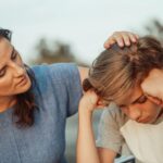 A mother offers support with calm, kindness and empathy to her teenage son